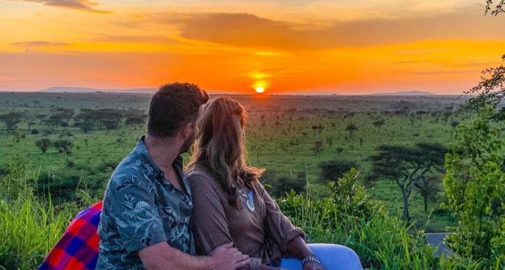 honeymooners-enjoying-sunset-during-serengeti-safari