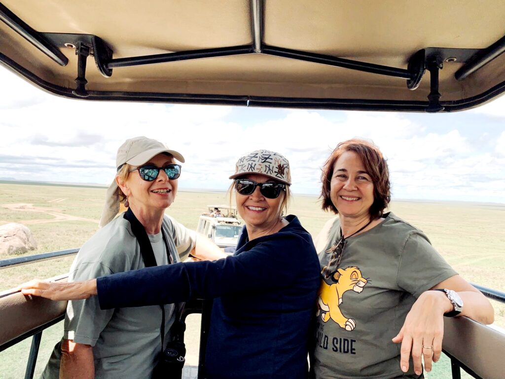 happy-guests-enjoying-game-drive-during-serengeti-safari